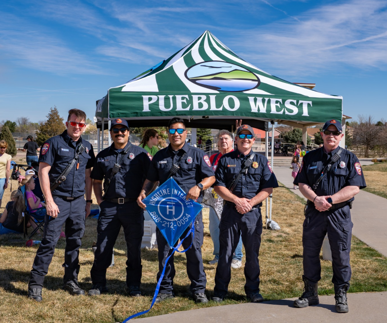 Pueblo West, CO - Kites and Coffee - Officers holding kite