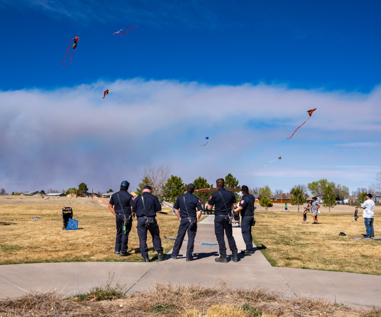 Pueblo West, CO - Kites and Coffee - Officers watching kites flying