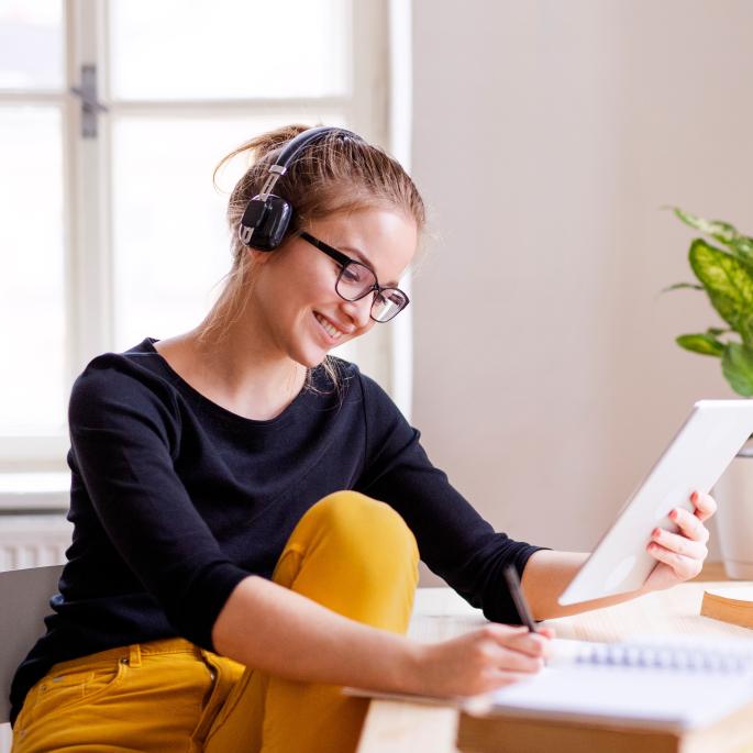 Photo of young woman in home office