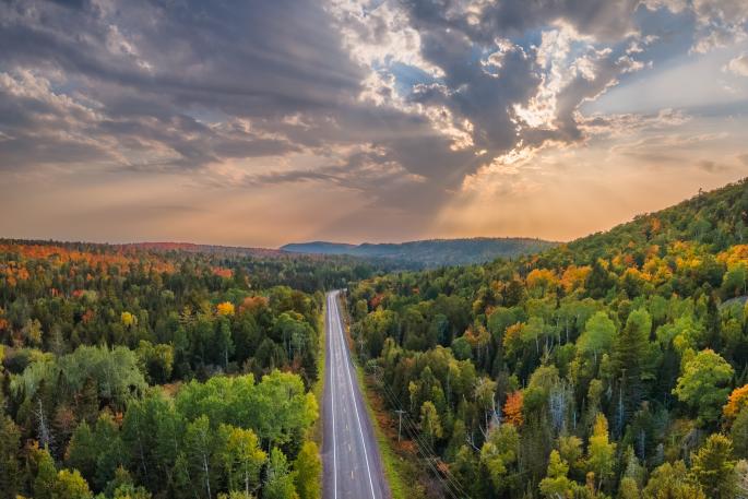 Sunset Autumn drive through the tunnel of Trees in Michigan Upper Peninsula