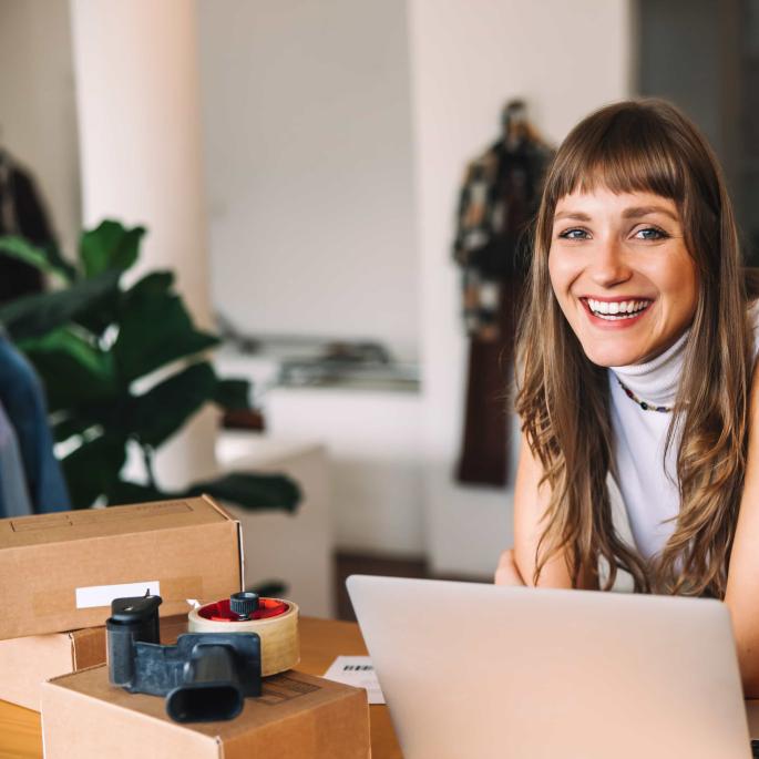 Woman smiling at laptop